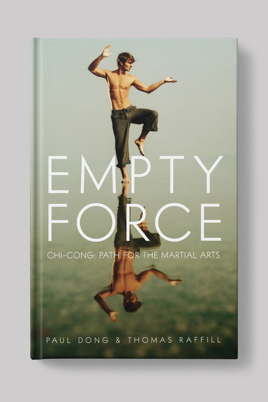 Front of the book cover for Empty Force, a martial arts book. Cover shows an image of a young man standing in Tai Chi pose on a beach, his image is reflected in the water beneath him.